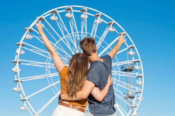 back-view-couple-watching-fun-wheel