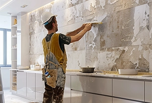 plasterboard worker installs. webp